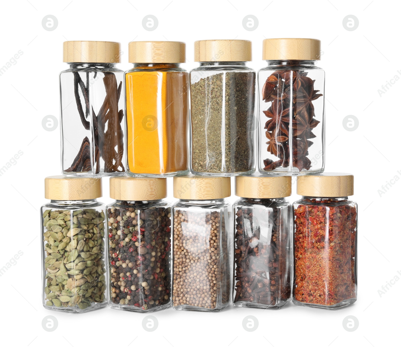 Photo of Different spices in glass jars isolated on white