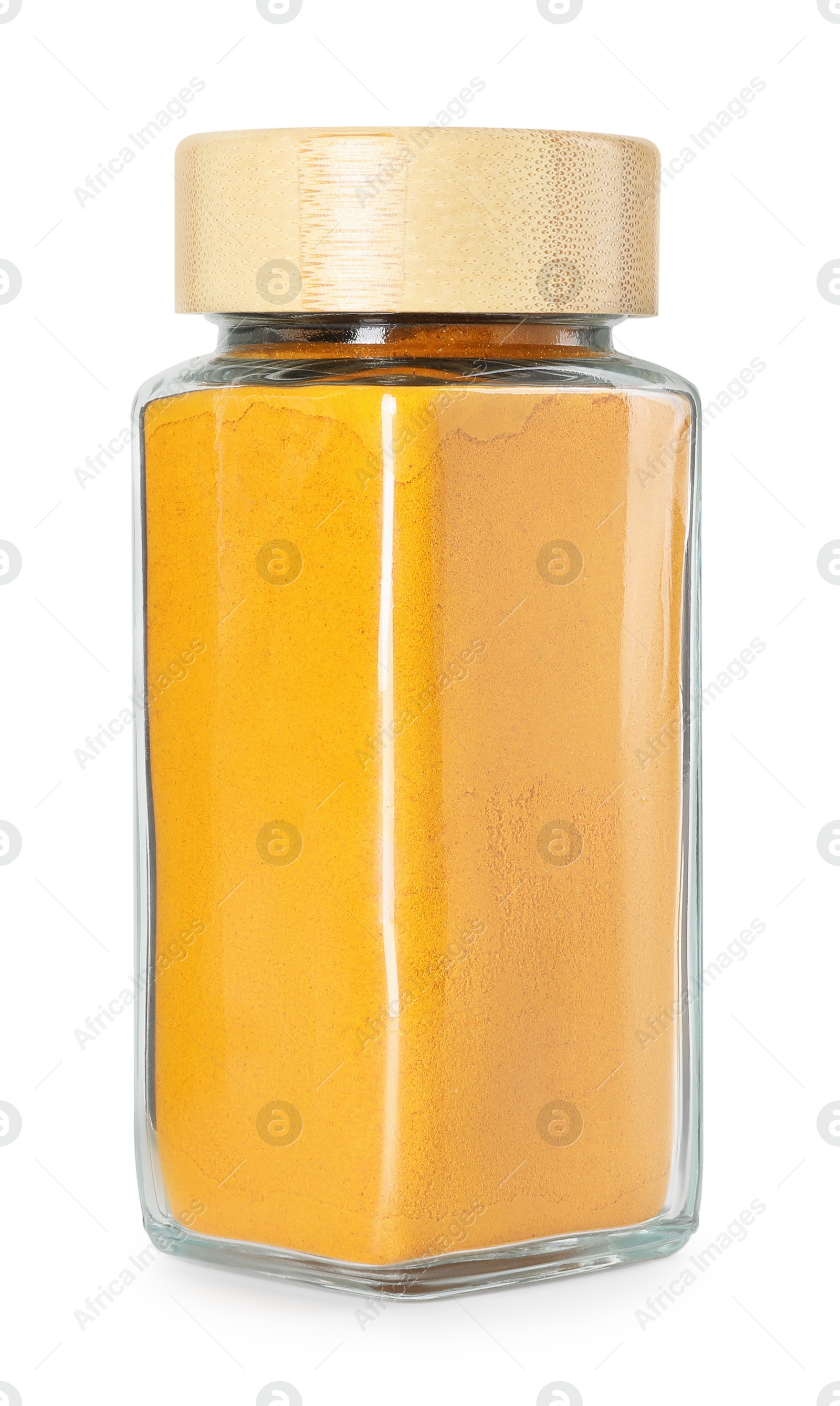 Photo of Curry powder in glass jar isolated on white