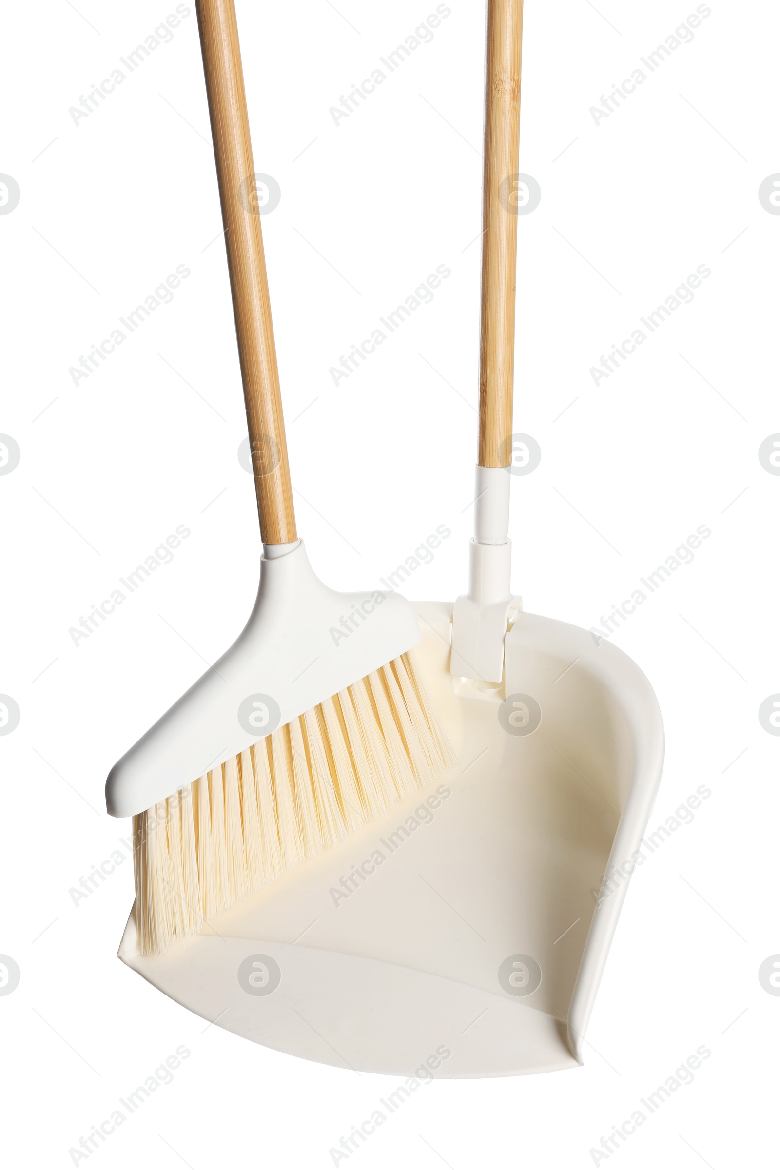 Photo of Broom and dustpan isolated on white. Cleaning tools