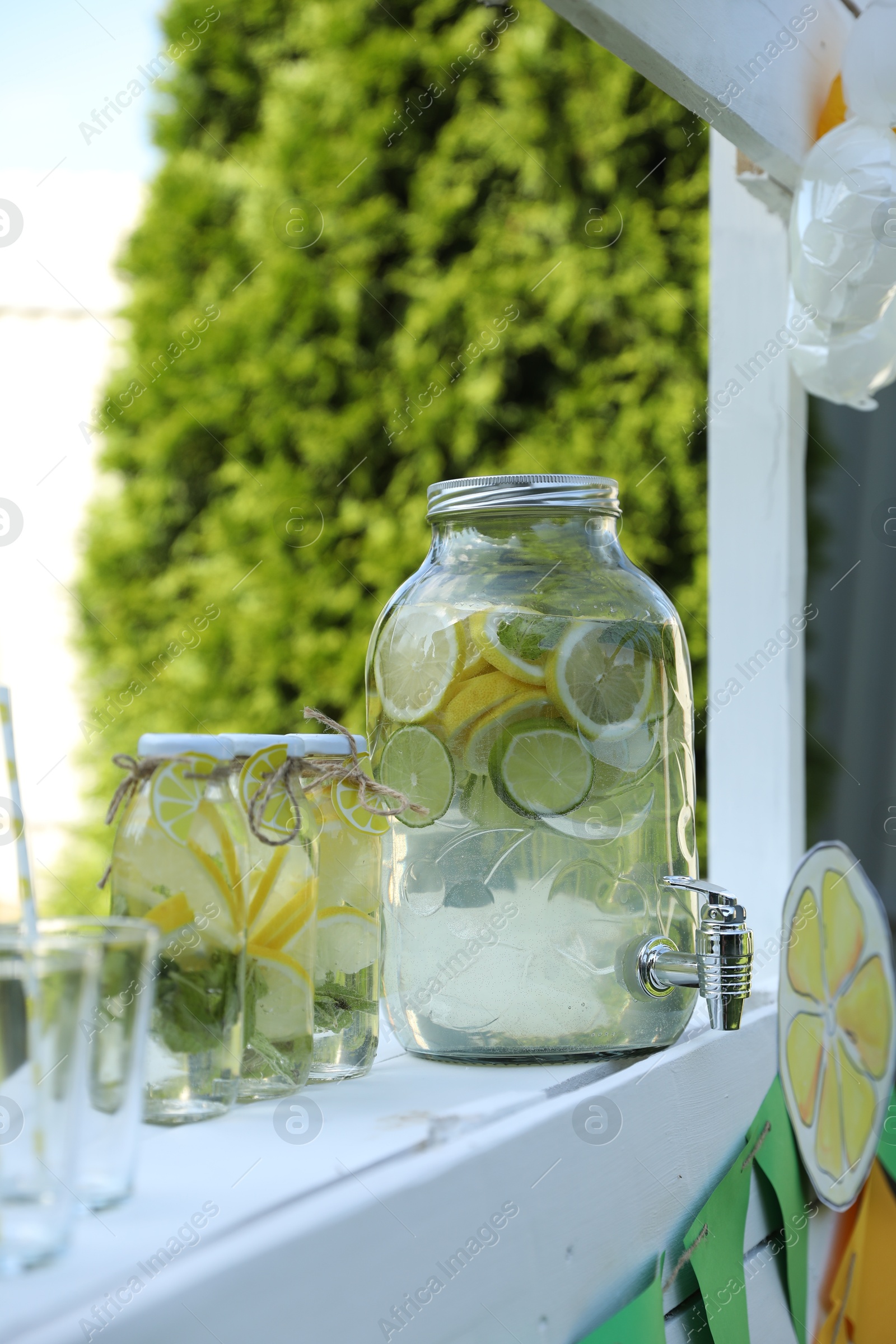 Photo of Lemonade stand with refreshing drink in park