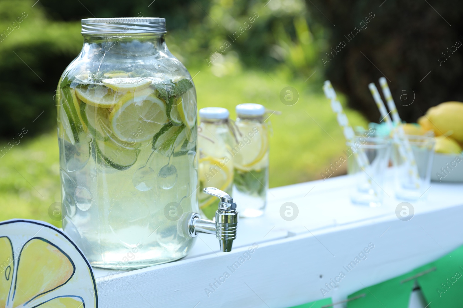 Photo of Lemonade stand with refreshing drink in park