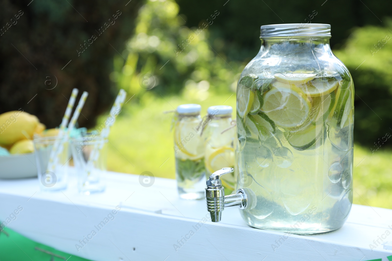 Photo of Lemonade stand with refreshing drink in park