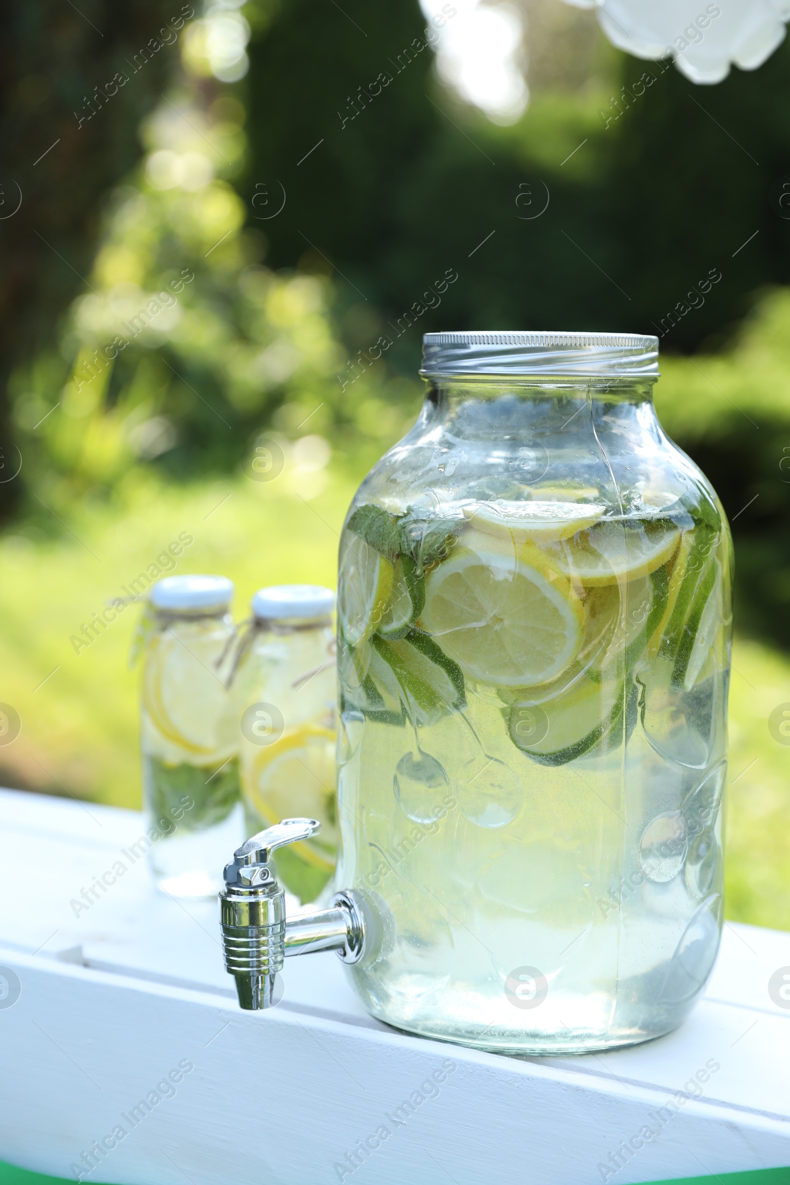 Photo of Lemonade stand with refreshing drink in park