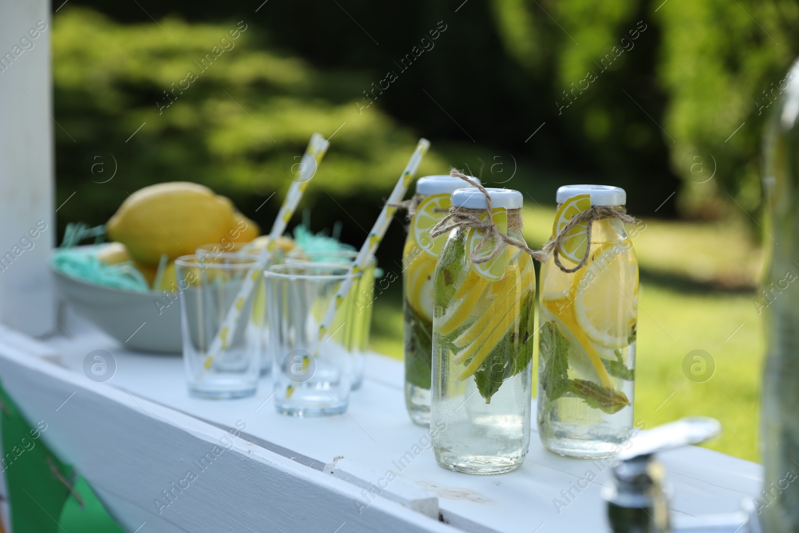 Photo of Lemonade stand with refreshing drink in park