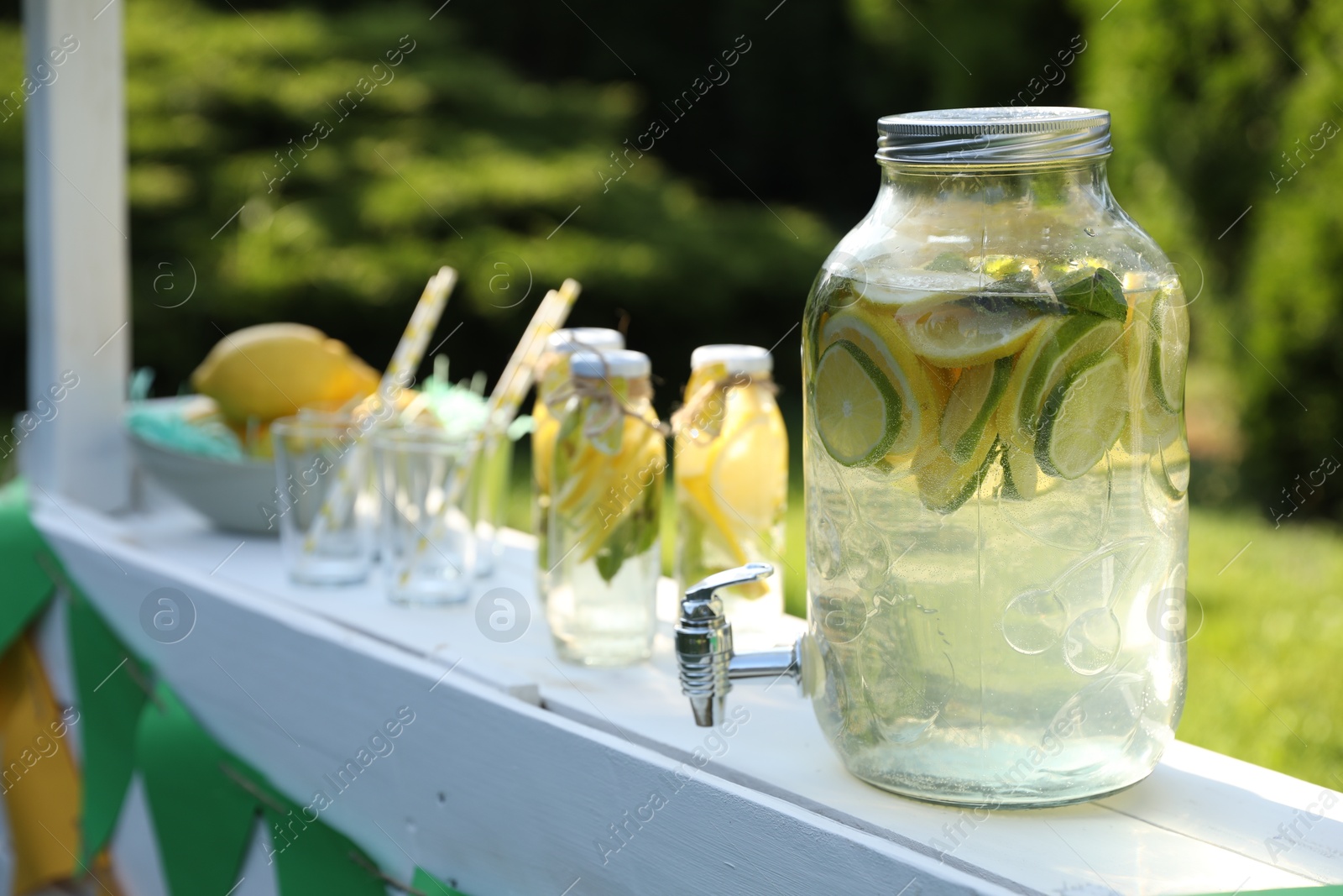 Photo of Lemonade stand with refreshing drink in park