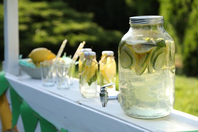 Photo of Lemonade stand with refreshing drink in park