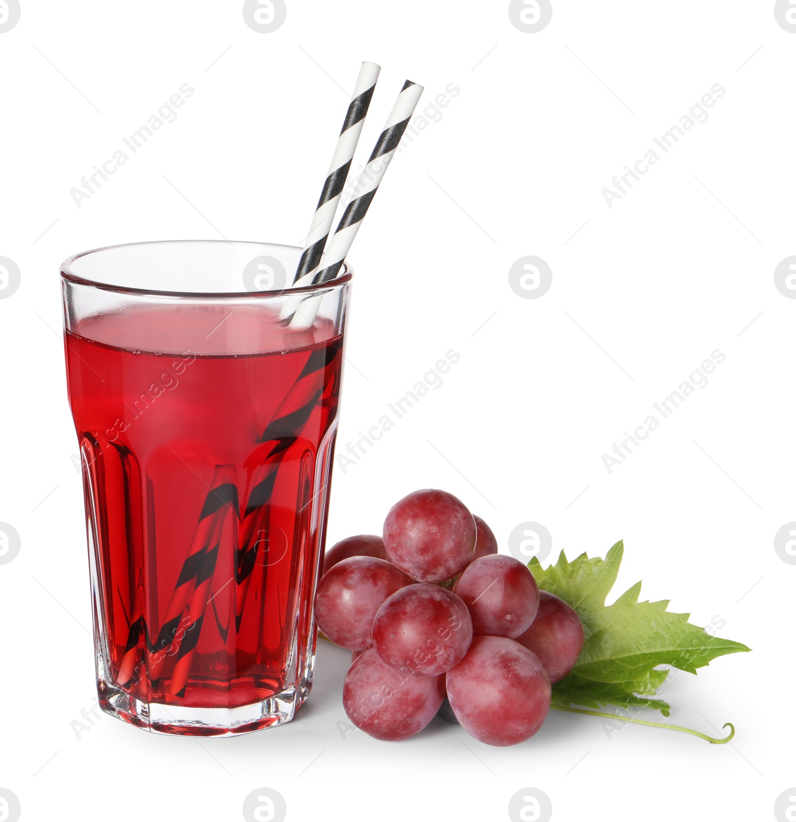 Photo of Tasty grape juice in glass, leaf and berries isolated on white