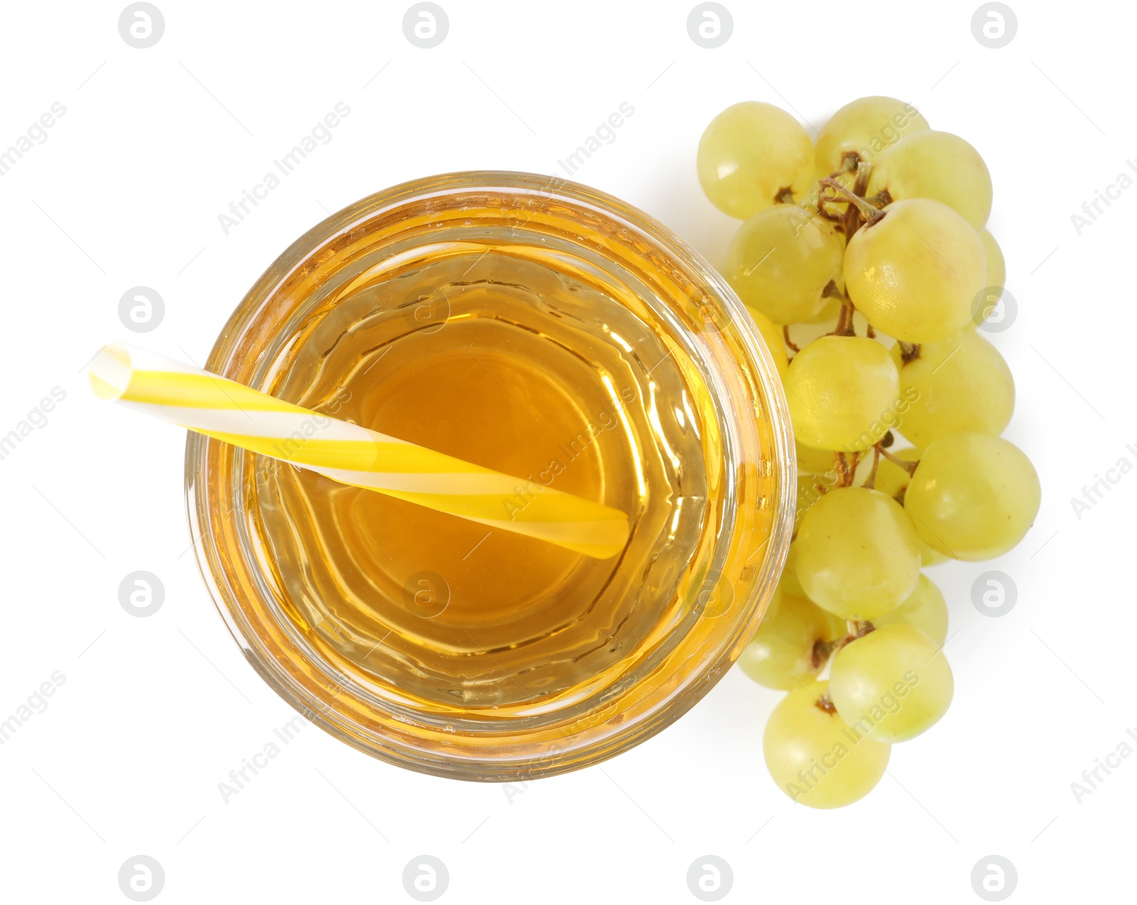 Photo of Ripe grapes and glass of tasty juice isolated on white, top view