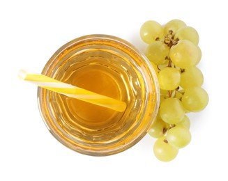 Photo of Ripe grapes and glass of tasty juice isolated on white, top view