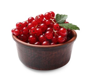 Photo of Ripe red currants with green leaves in bowl isolated on white