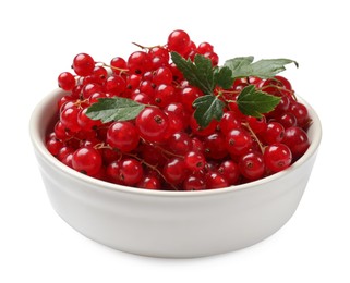 Photo of Ripe red currants with green leaves in bowl isolated on white