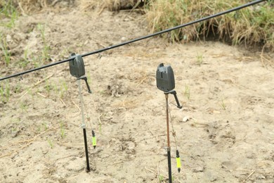 Photo of Fishing rod and bite alarms near lake at summer