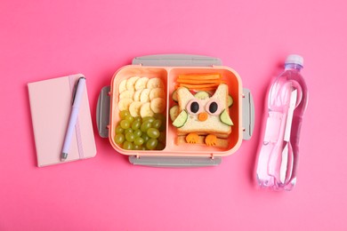 Photo of Lunch box with snacks, bottle of water and stationery on pink background, flat lay