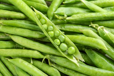 Many fresh green pods as background, closeup