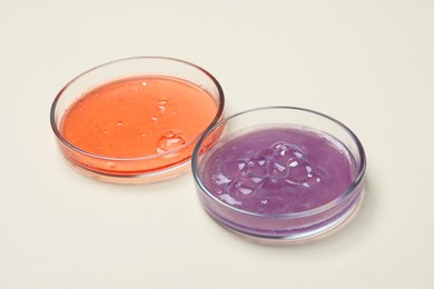 Photo of Petri dishes with samples on beige background