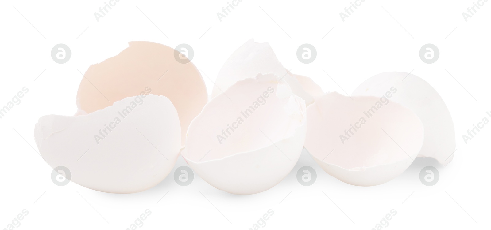 Photo of Pile of broken eggshells isolated on white