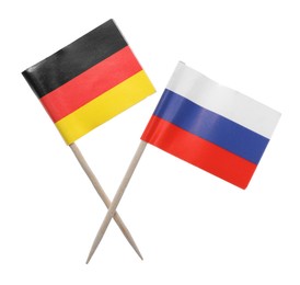 Photo of Small paper flags of Russia and Germany isolated on white