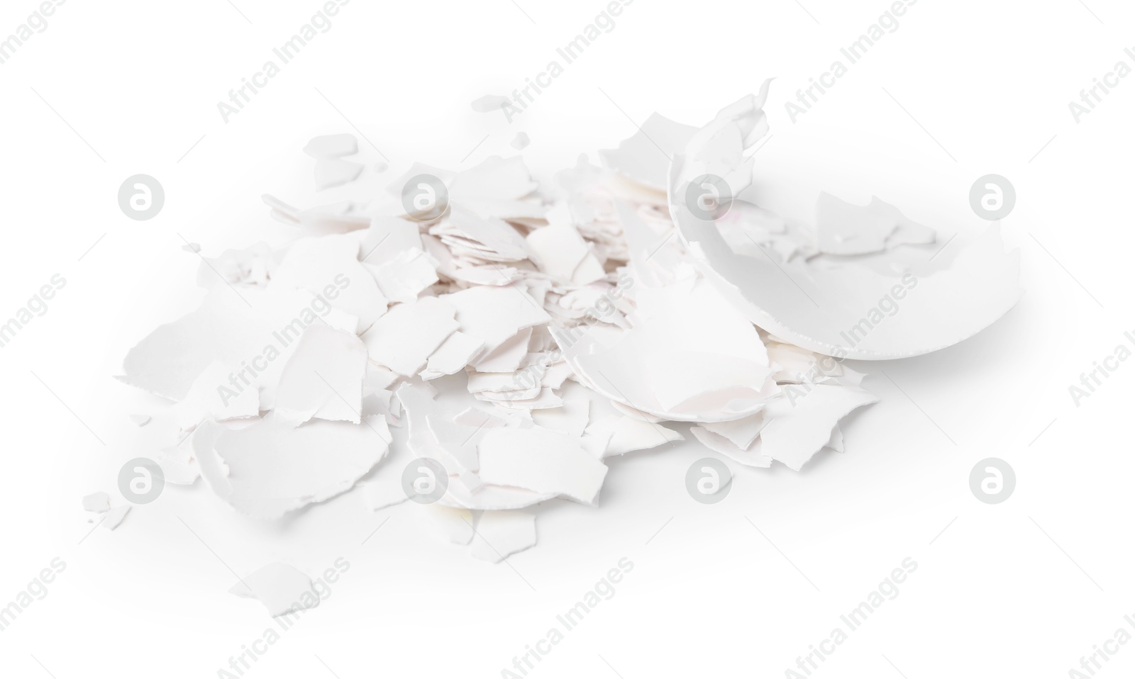 Photo of Pile of broken eggshells isolated on white