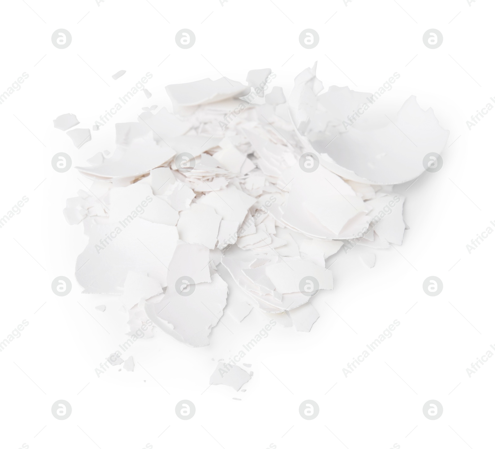 Photo of Pile of broken eggshells isolated on white