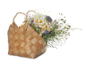 Photo of Beautiful wildflowers in bag isolated on white