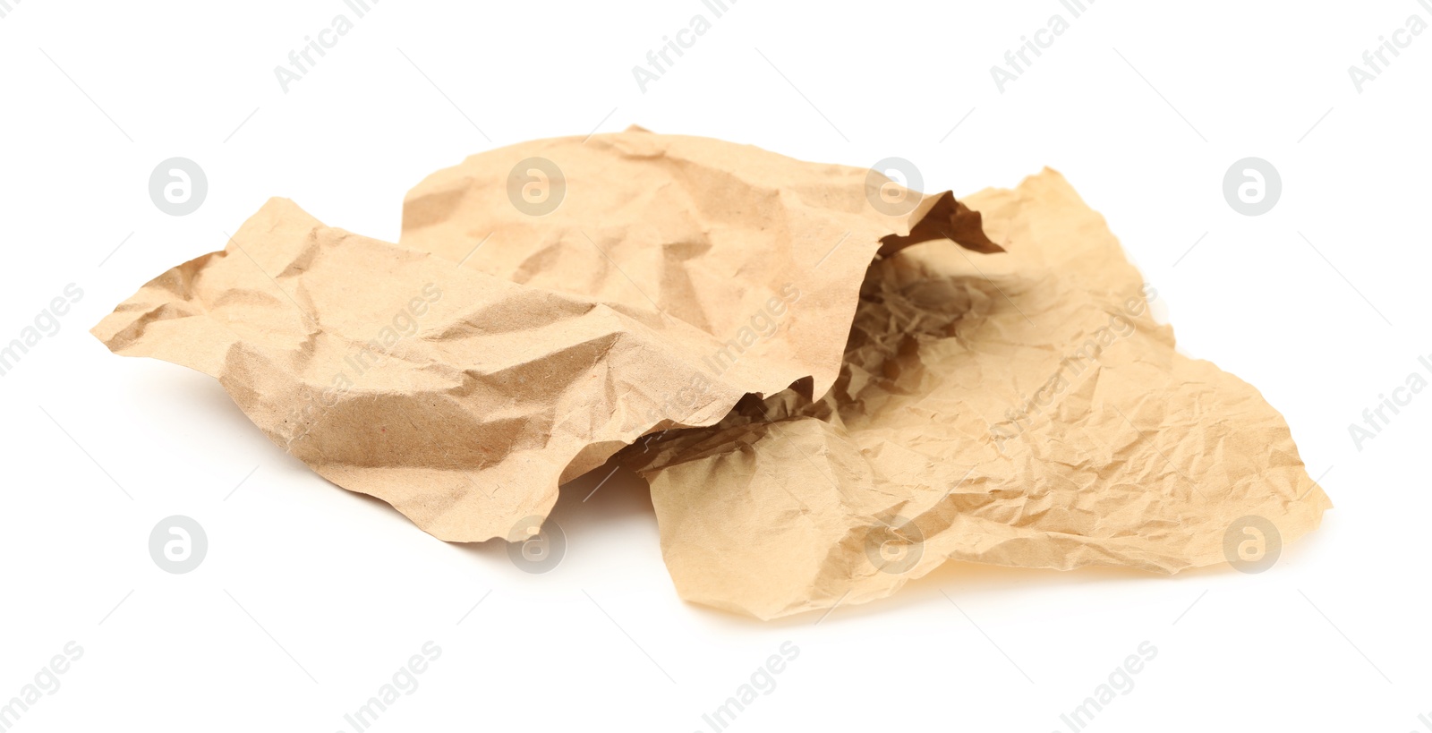 Photo of Crumpled kraft paper sheets isolated on white