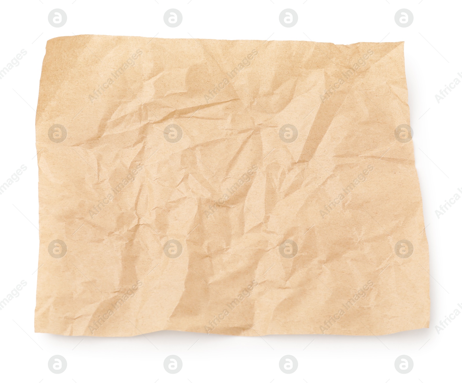 Photo of Crumpled kraft paper sheet isolated on white, top view