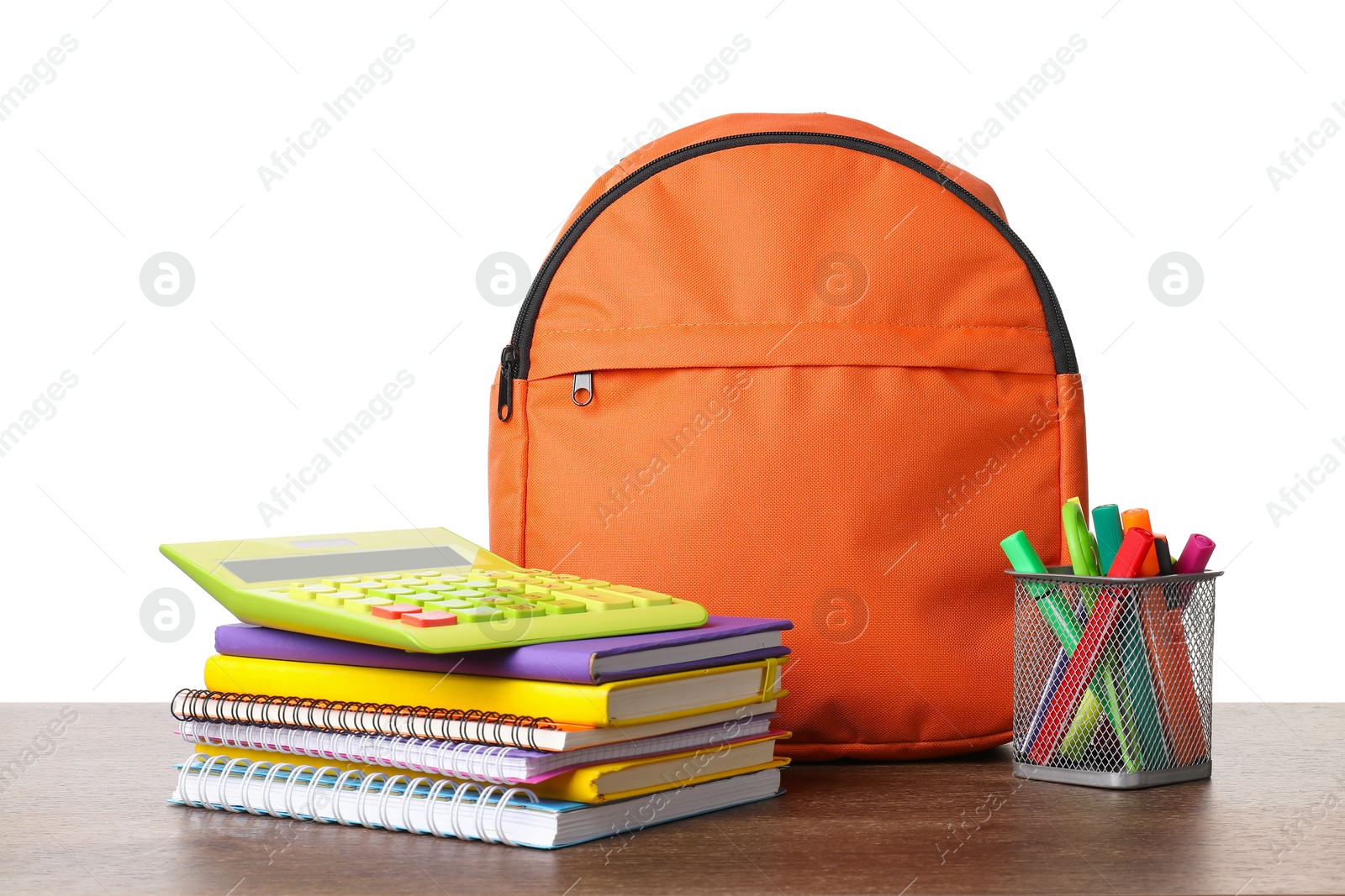 Photo of Backpack with different school stationery on wooden table against white background