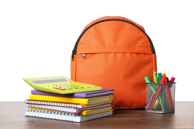 Photo of Backpack with different school stationery on wooden table against white background