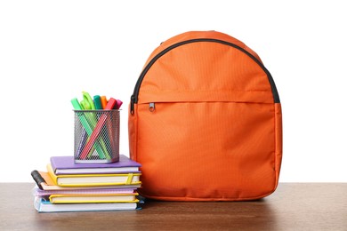 Photo of Backpack with different school stationery on wooden table against white background