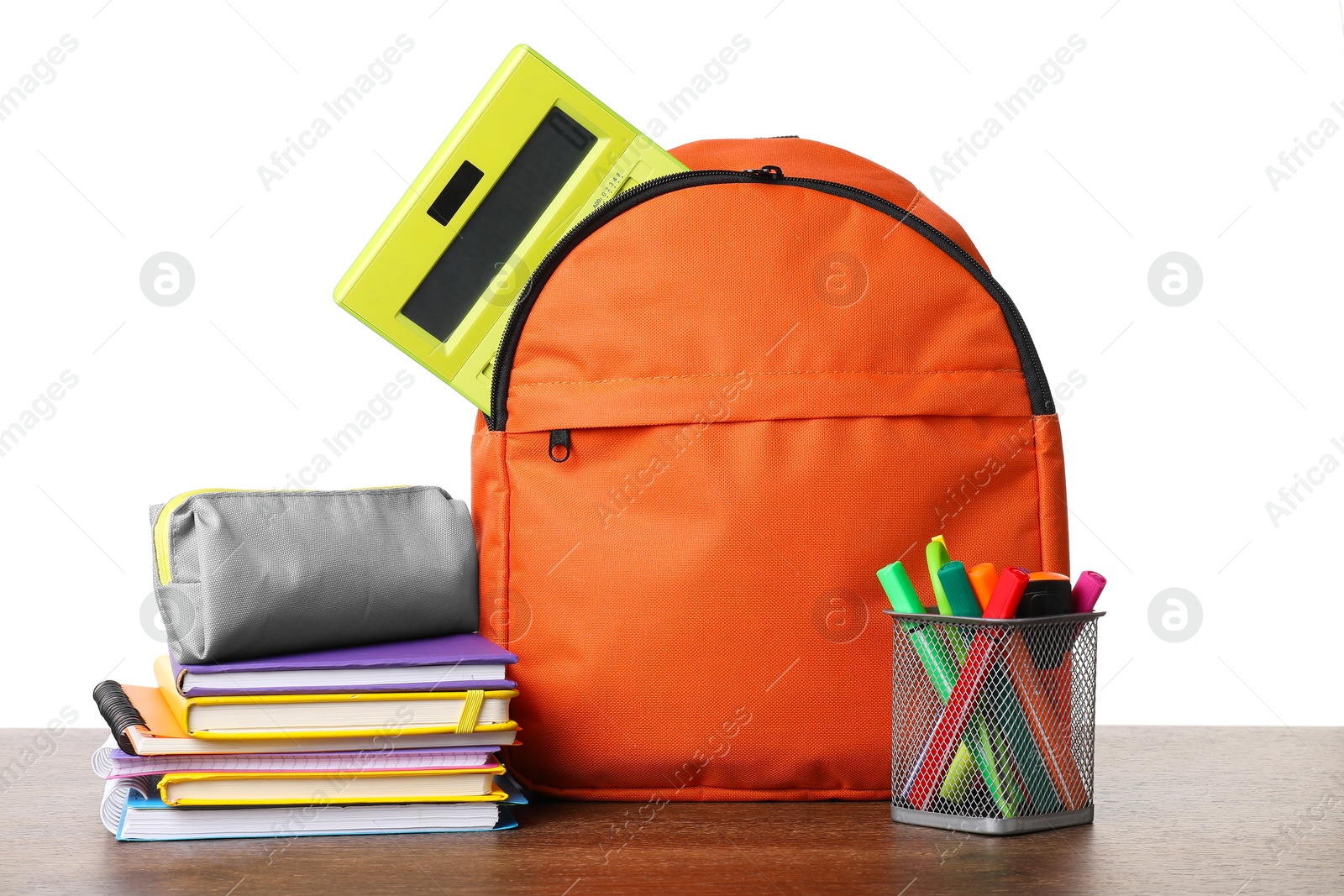 Photo of Backpack with different school stationery on wooden table against white background