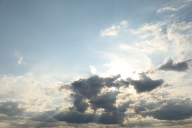 Photo of Sun shining through clouds on beautiful sky