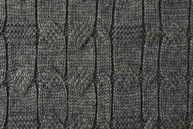 Photo of Texture of grey knitted fabric as background, top view