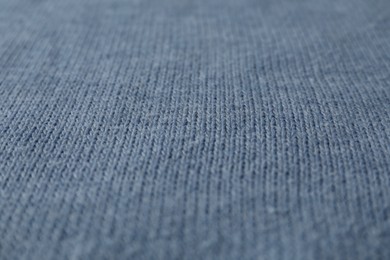 Texture of blue knitted fabric as background, closeup