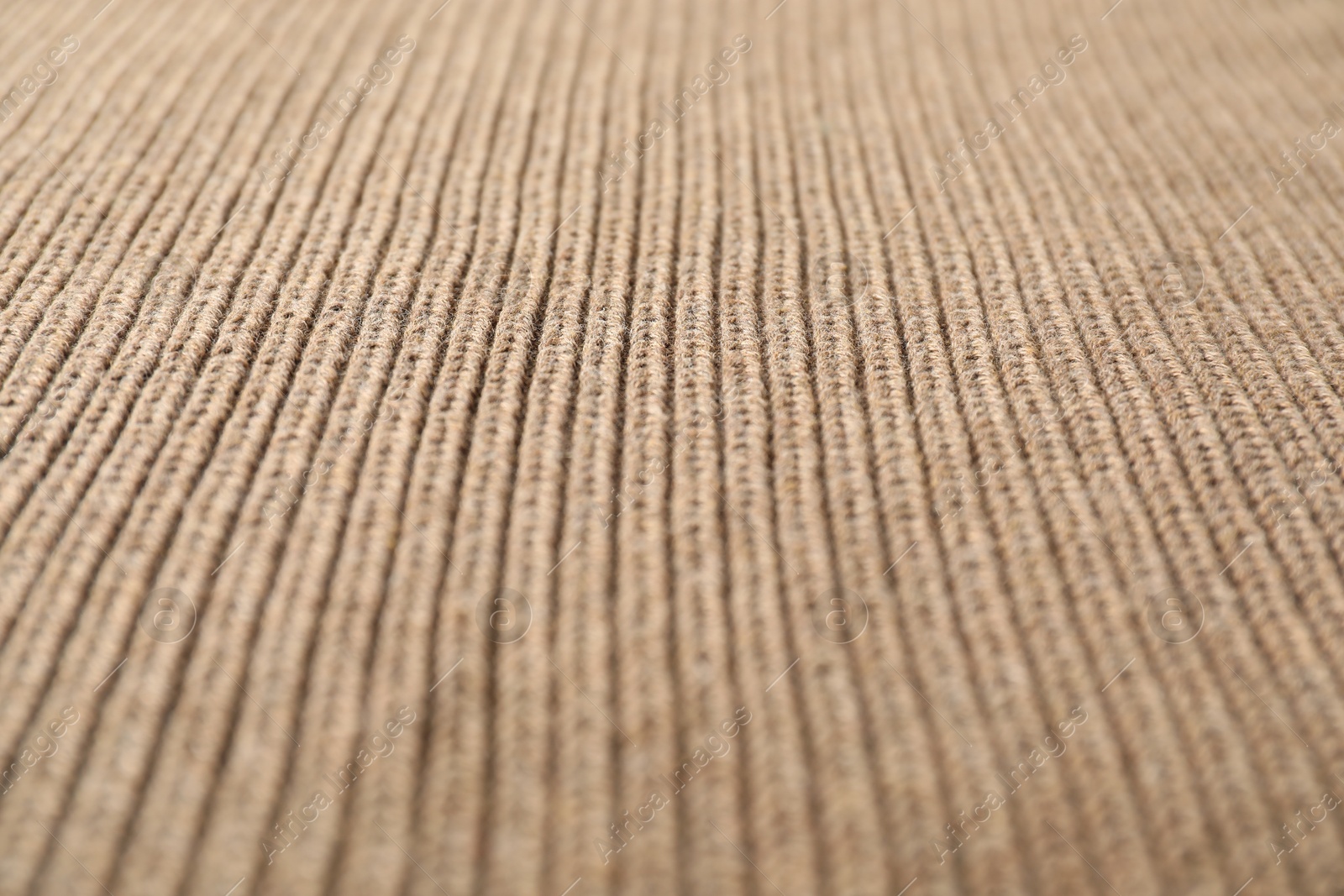 Photo of Texture of brown knitted fabric as background, closeup