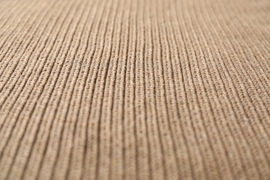 Photo of Texture of brown knitted fabric as background, closeup