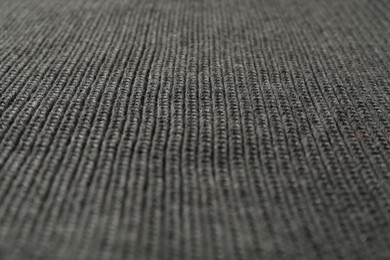 Photo of Texture of grey knitted fabric as background, closeup