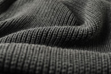 Photo of Texture of grey knitted fabric as background, closeup