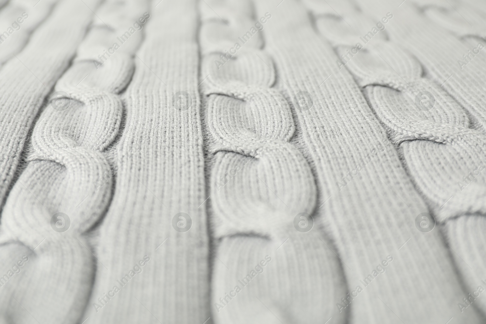 Photo of Texture of white knitted fabric as background, closeup