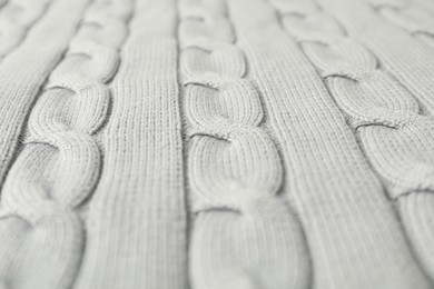 Texture of white knitted fabric as background, closeup