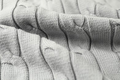 Photo of Texture of white knitted fabric as background, closeup