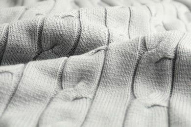 Texture of white knitted fabric as background, closeup