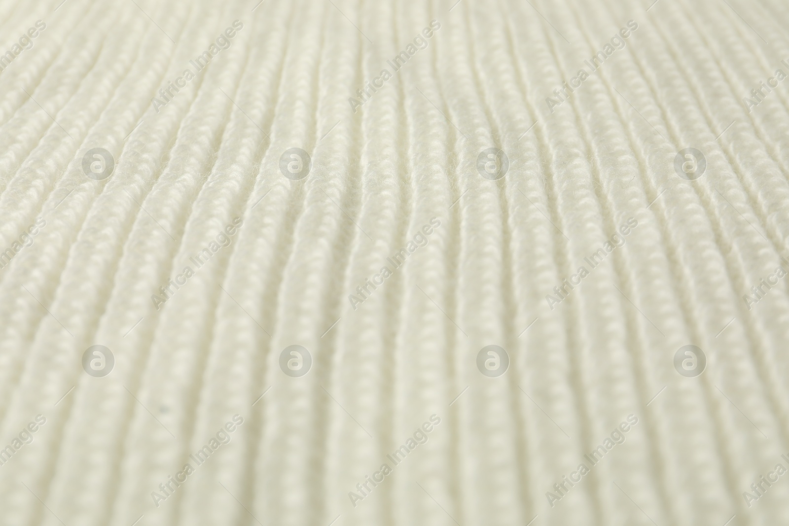 Photo of Texture of white knitted fabric as background, closeup