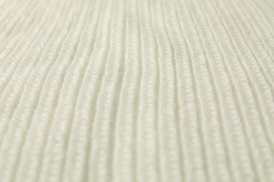 Photo of Texture of white knitted fabric as background, closeup