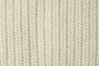 Photo of Texture of white knitted fabric as background, top view