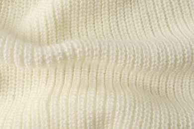 Photo of Texture of white knitted fabric as background, closeup