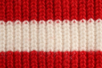 Photo of Texture of colorful knitted fabric as background, top view