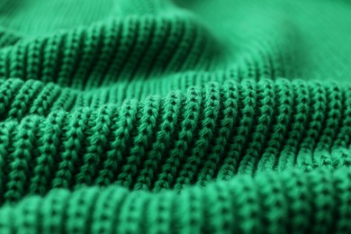 Photo of Texture of green knitted fabric as background, closeup