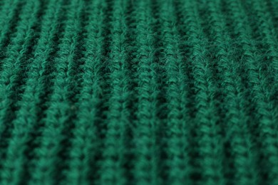 Photo of Texture of green knitted fabric as background, closeup