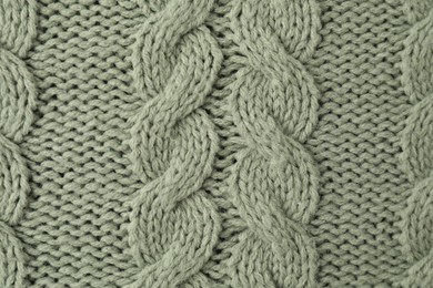 Photo of Texture of color knitted fabric as background, top view