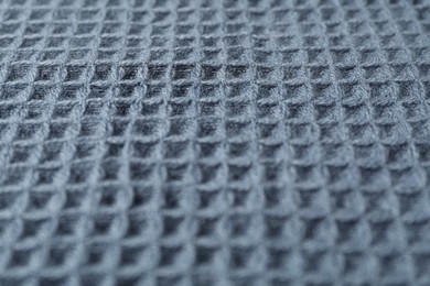 Photo of Texture of blue knitted fabric as background, closeup